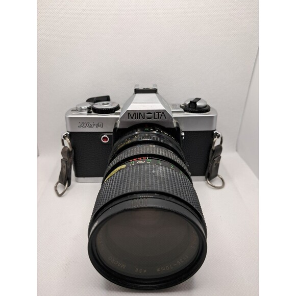 Minolta XG-A 35mm SLR Film Camera W/ Access P-MC 1:2.5-3.5 35-70mm Untest As Is